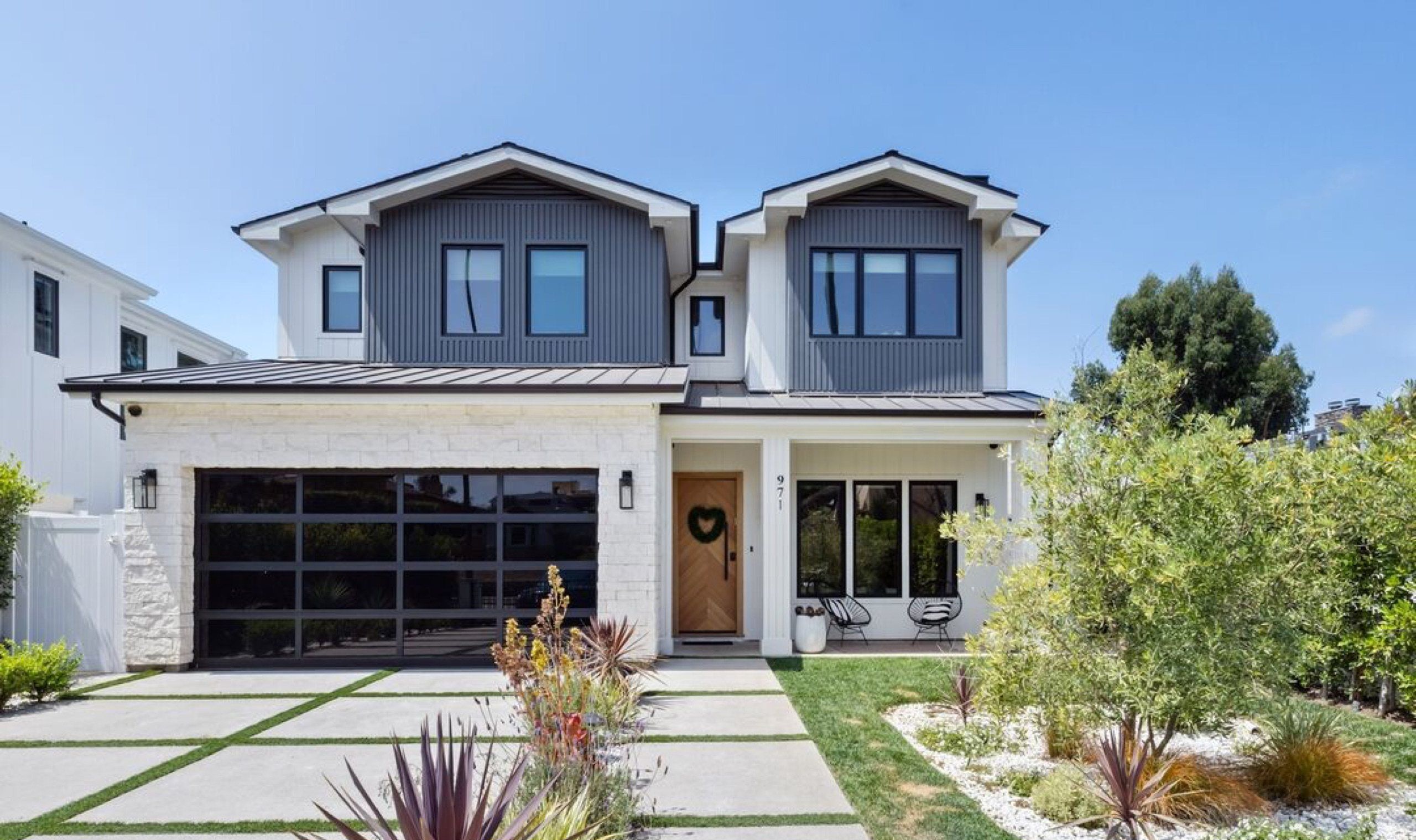 Modern farmhouse facade of 971 South Bundy Drive in Brentwood