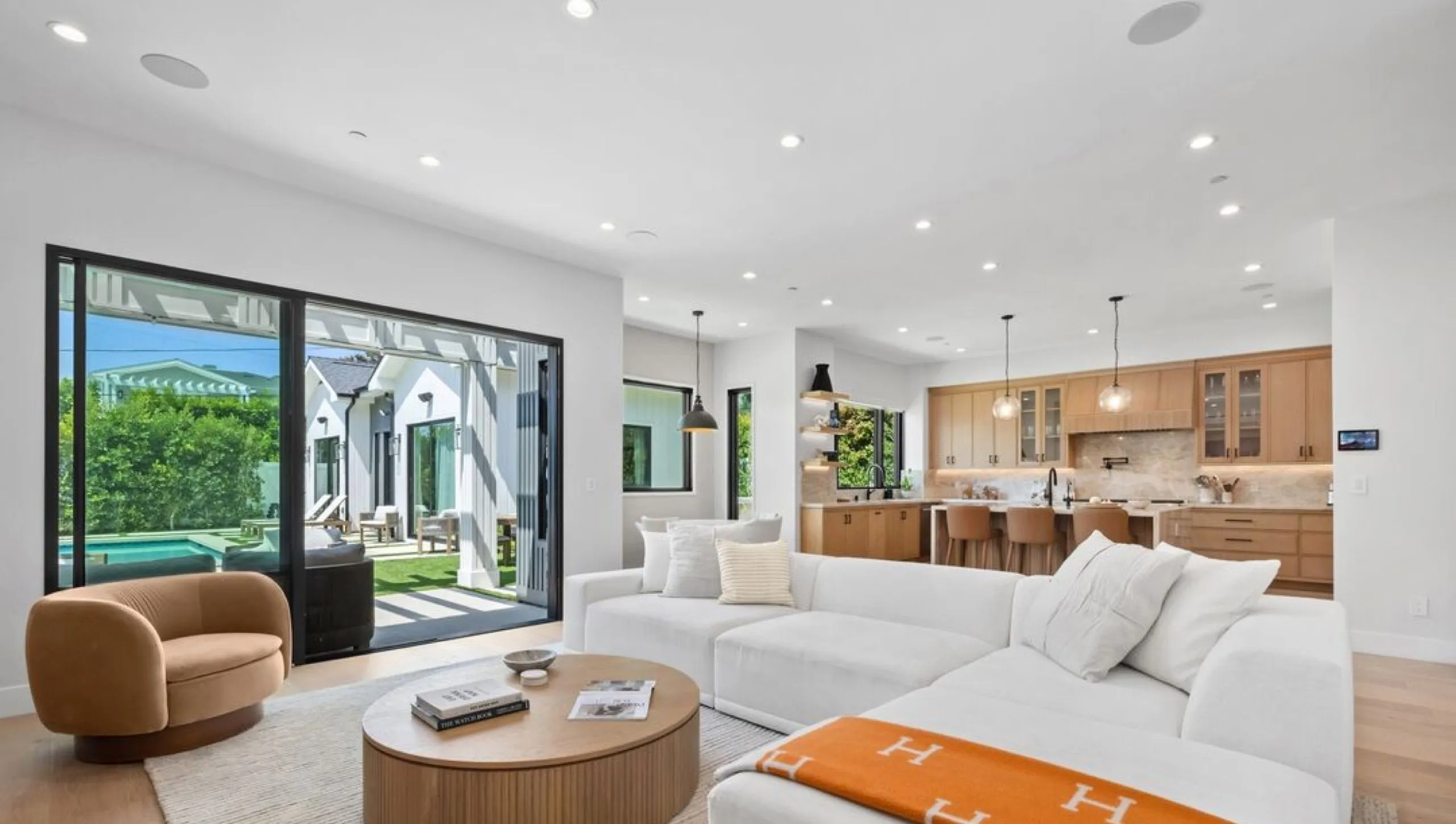Family room opening to the pool at 971 South Bundy Drive, Brentwood