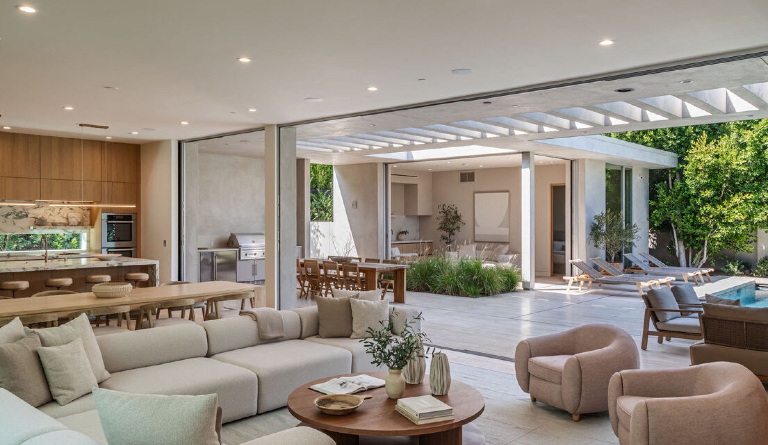 Living room opening onto the pool terrace at 634 Moreno Avenue