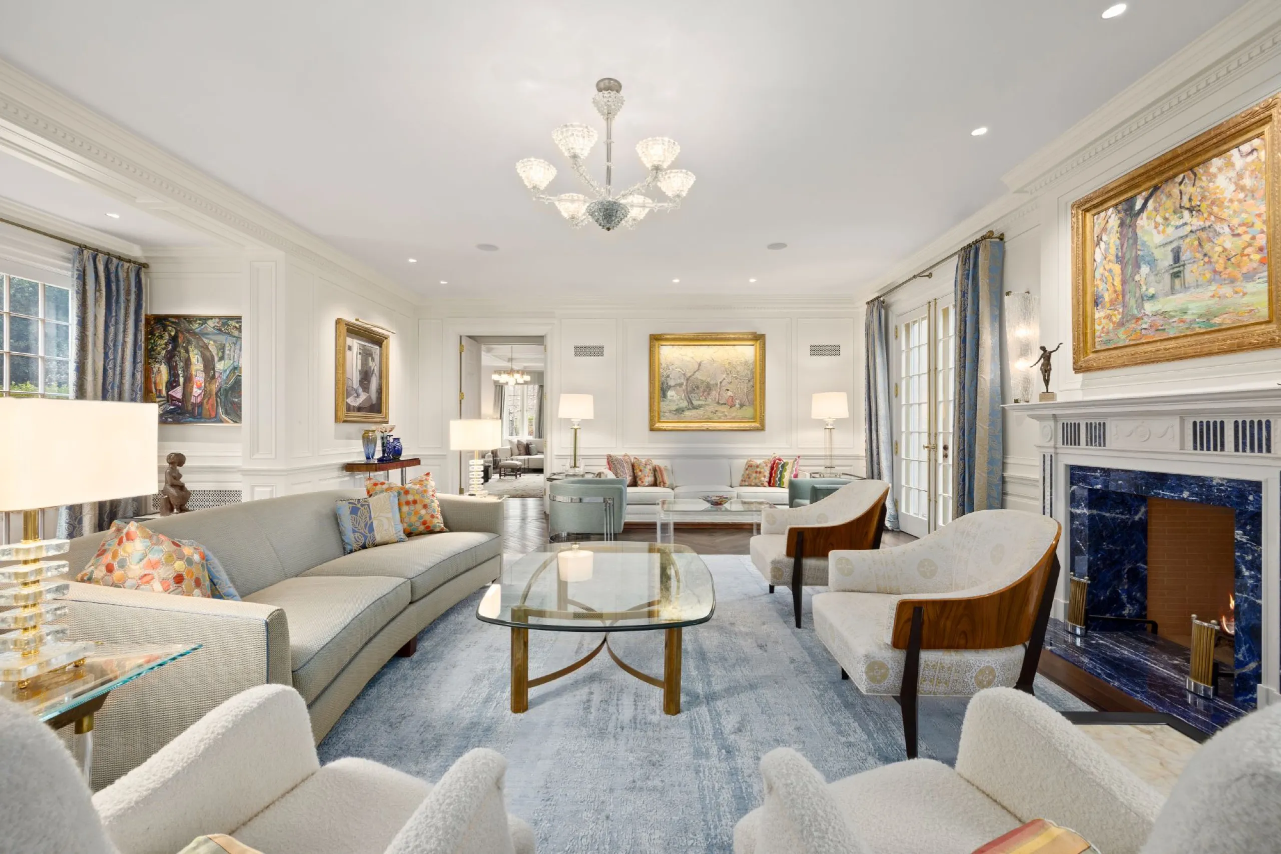 Formal living room with blue sodalite marble fireplace and garden French doors