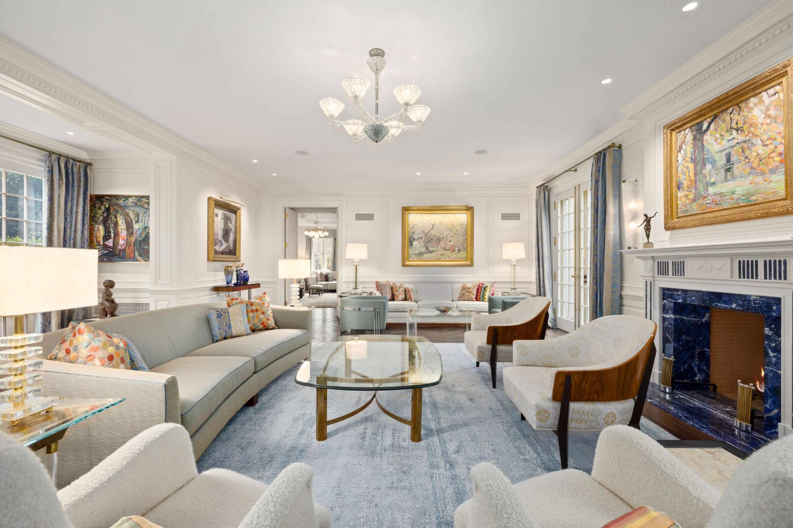 Formal living room with blue sodalite marble fireplace and garden French doors