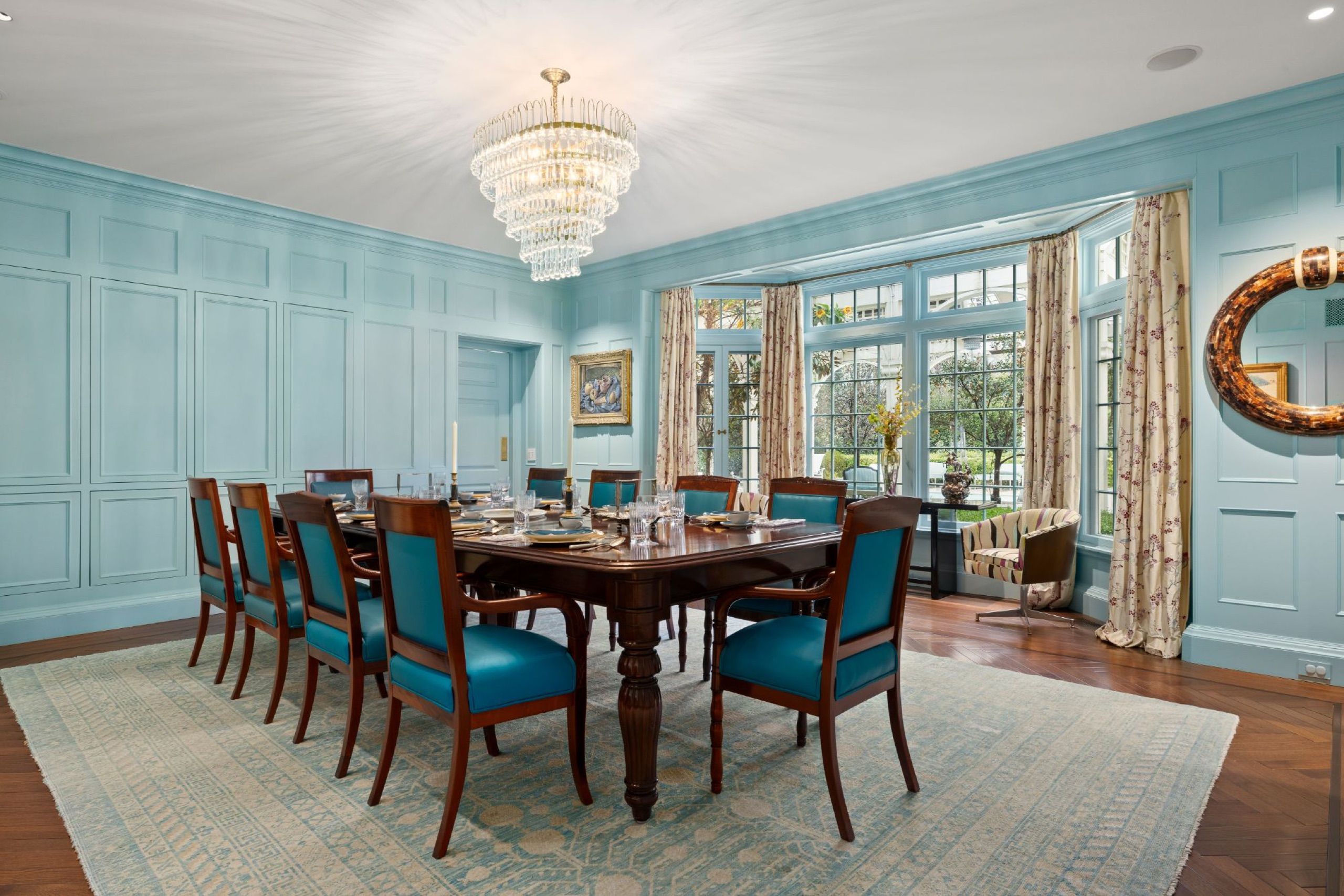 Formal dining room with crystal chandelier and robin's egg blue paneling