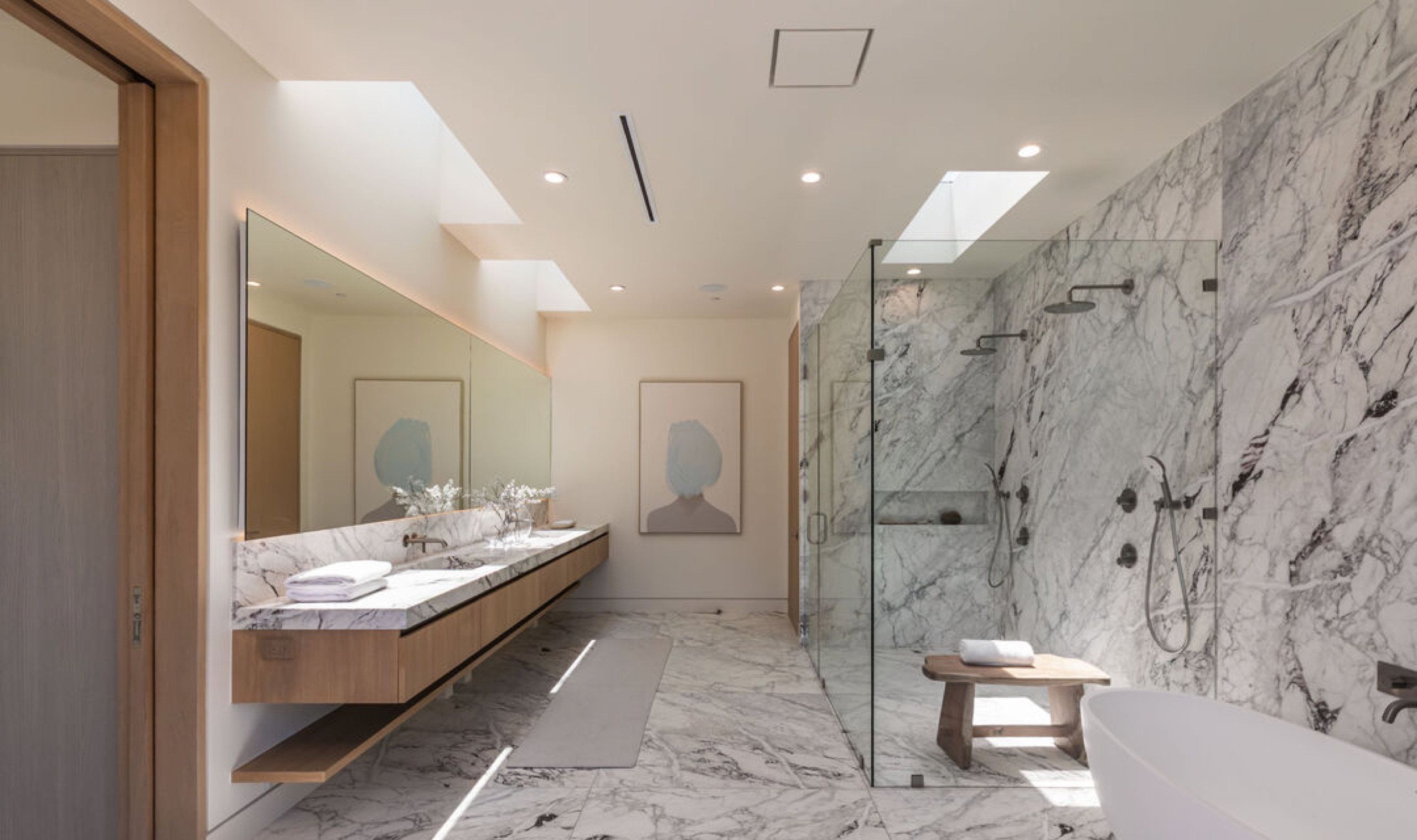 Marble primary bath with freestanding tub and walk in shower